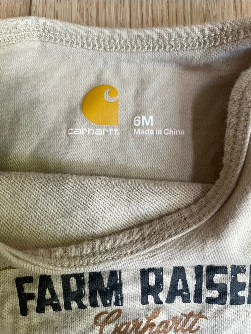 Carhartt Cream Baby Long Sleeve Onesie with Yellow Logo